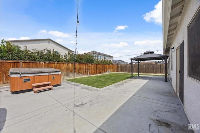 9008 Pine Breeze Ln, Shafter, CA 93263 - view of patio with a fenced backyard, a gazebo, and a hot tub