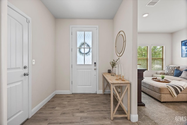 9008 Pine Breeze Ln, Shafter, CA 93263 - foyer entrance featuring visible vents, baseboards, and wood finished floors