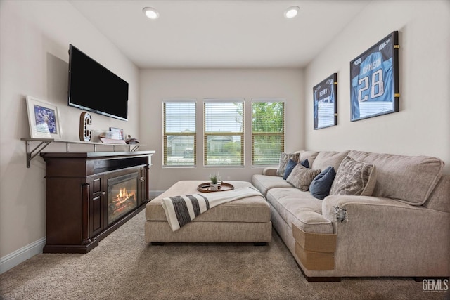 9008 Pine Breeze Ln, Shafter, CA 93263 - living area with carpet flooring, recessed lighting, baseboards, and a glass covered fireplace