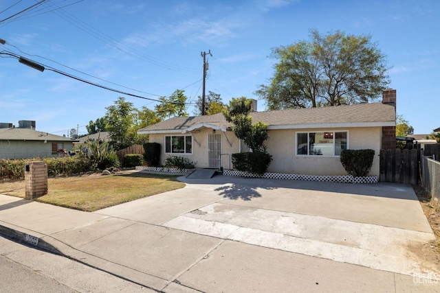 ranch-style home with a front yard