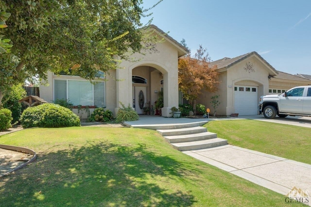 view of front facade with a garage and a front yard