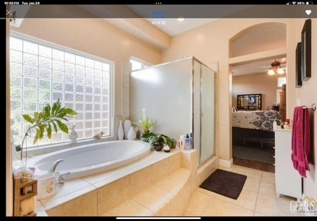 bathroom with tile patterned flooring, shower with separate bathtub, and ceiling fan