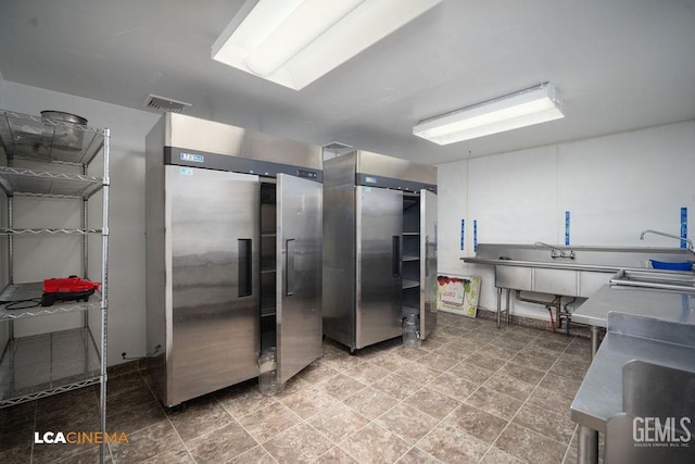 428 Center St Unit A, Taft, CA 93268 - kitchen with white cabinetry and freestanding refrigerator