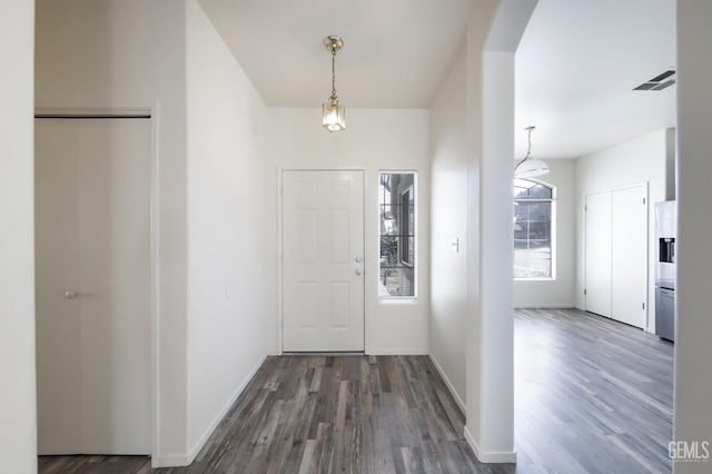 entryway with dark hardwood / wood-style floors