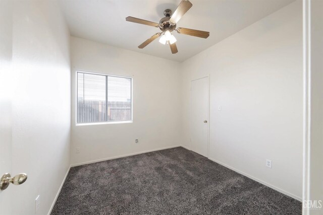 unfurnished room featuring dark hardwood / wood-style flooring and ceiling fan