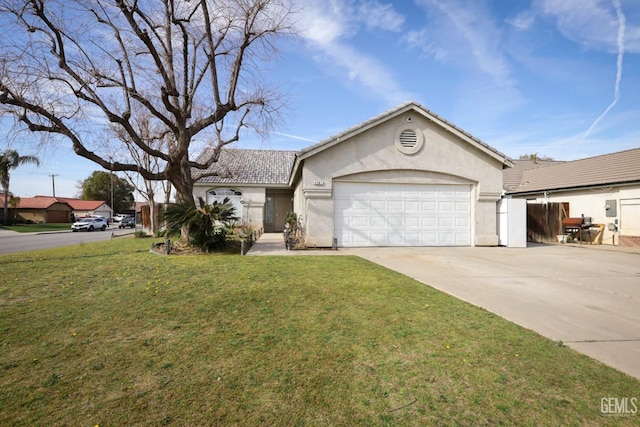 view of front of home with a garage and a front yard