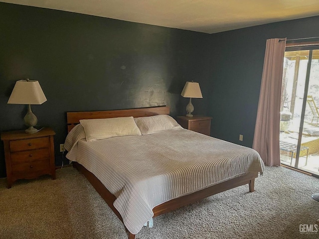 carpeted bedroom with access to exterior
