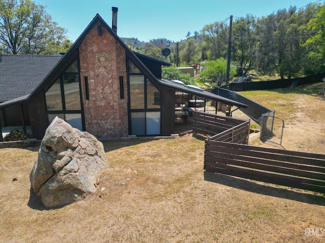 view of property exterior featuring brick siding
