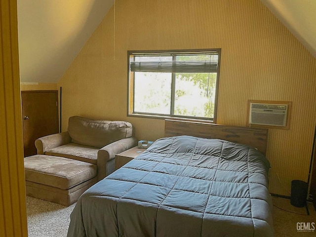 carpeted bedroom with an AC wall unit and lofted ceiling