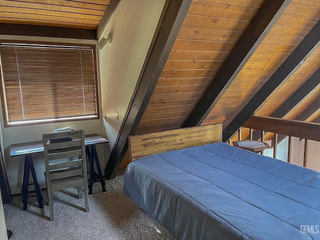 bedroom with beam ceiling, carpet flooring, and wood ceiling