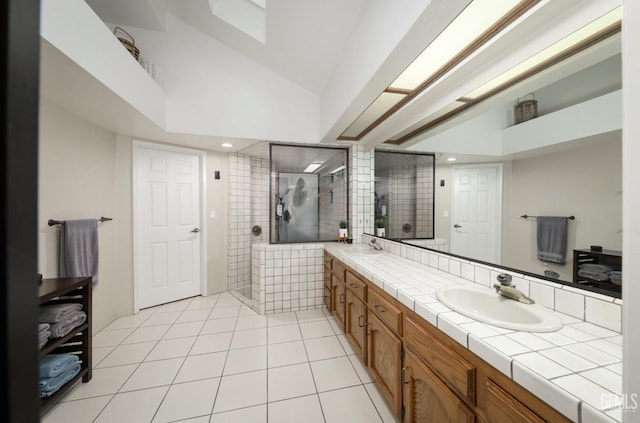 7305 Wilford Ct, Bakersfield, CA 93309 - bathroom with double vanity, a tile shower, tile patterned floors, recessed lighting, and high vaulted ceiling