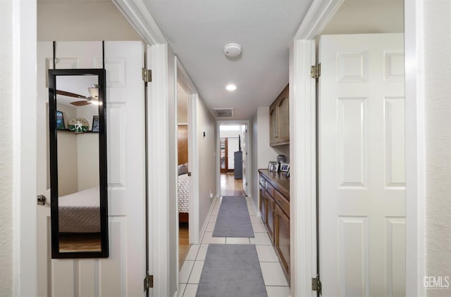 7305 Wilford Ct, Bakersfield, CA 93309 - hall with light tile patterned flooring and baseboards