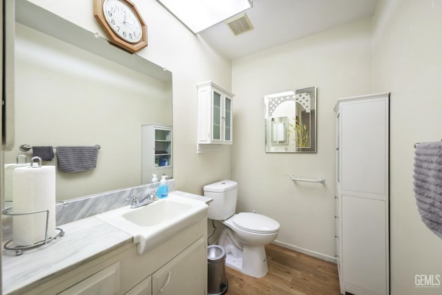 712 River Oaks Dr, Bakersfield, CA 93309 - bathroom with wood finished floors and vanity