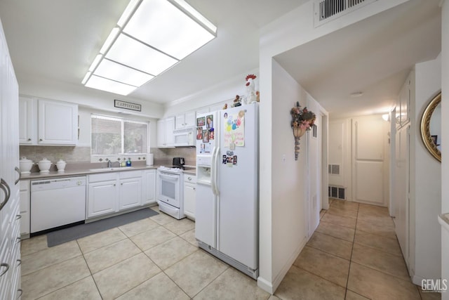 712 River Oaks Dr, Bakersfield, CA 93309 - kitchen featuring white appliances, light tile patterned flooring, and white cabinetry