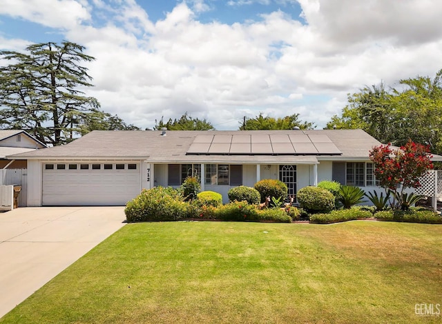 712 River Oaks Dr, Bakersfield, CA 93309 - single story home featuring an attached garage, a front lawn, solar panels, and driveway
