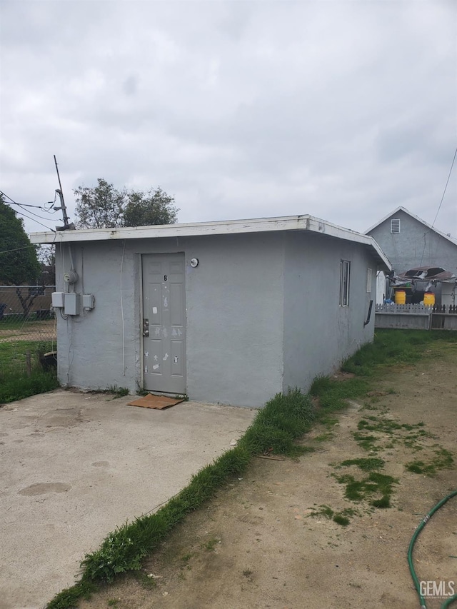 view of outdoor structure featuring fence