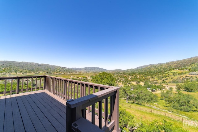 wooden terrace with a mountain view and a rural view