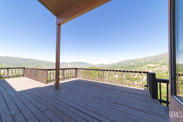 wooden terrace with a mountain view