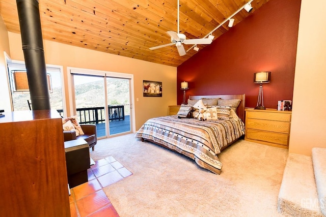 bedroom with carpet floors, access to exterior, wood ceiling, and track lighting