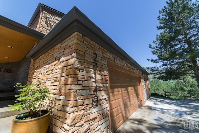 view of side of property with stone siding