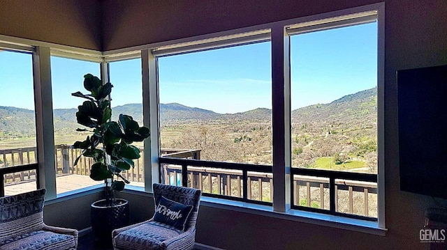 sunroom / solarium with a mountain view