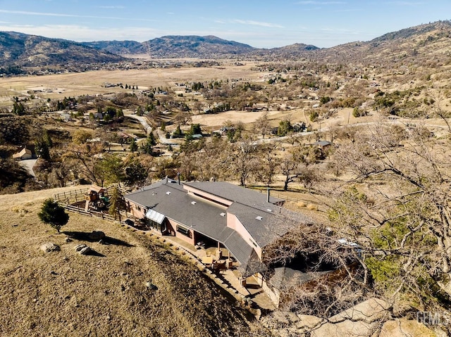 drone / aerial view featuring a mountain view