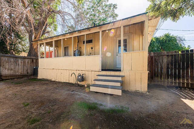 view of outbuilding with a fenced backyard