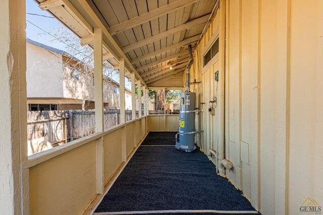 view of patio featuring strapped water heater