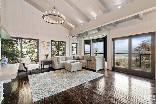 living room with an inviting chandelier, wood walls, wood-type flooring, beam ceiling, and high vaulted ceiling