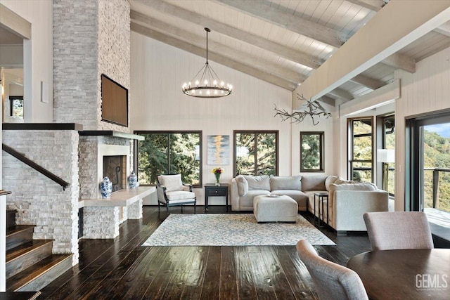 living room with beamed ceiling, high vaulted ceiling, and hardwood / wood-style floors
