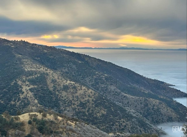mountain view featuring a water view
