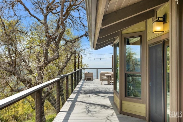 balcony featuring a water view