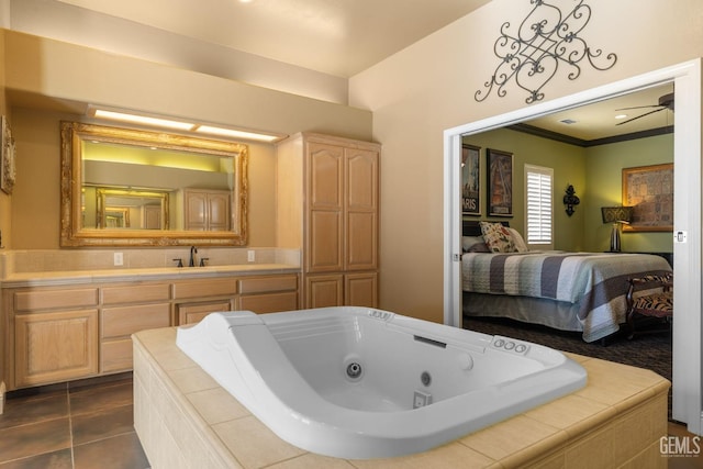 4906 Palisades Cir, Bakersfield, CA 93308 - bathroom with a jetted tub, vanity, ornamental molding, tile patterned floors, and ensuite bathroom