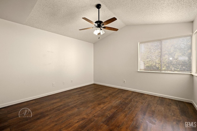 unfurnished room featuring dark wood-type flooring, ceiling fan, lofted ceiling, and a textured ceiling