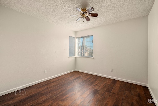 spare room featuring a textured ceiling, dark wood-type flooring, and ceiling fan