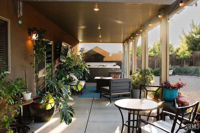 9512 Four Pines Dr, Shafter, CA 93263 - view of patio / terrace with a hot tub and fence