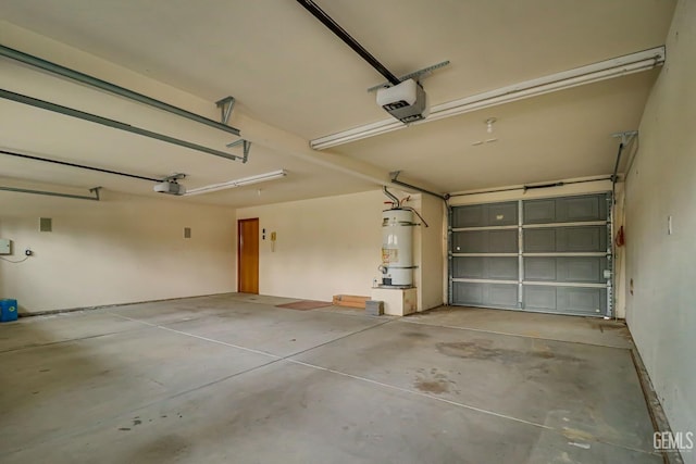 garage with water heater and a garage door opener