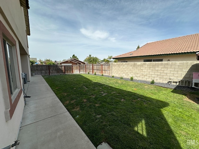 view of yard with a fenced backyard