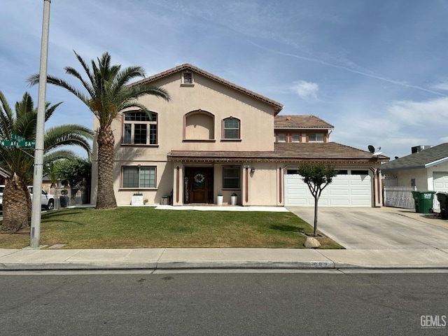 view of front of home featuring driveway, a front yard, stucco siding, and a garage