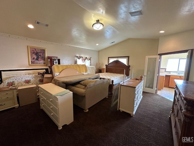 bedroom featuring visible vents, dark colored carpet, lofted ceiling, and recessed lighting