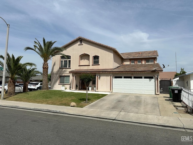 view of front of property featuring driveway, stucco siding, a front yard, fence, and a garage