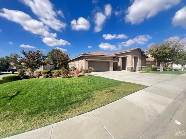 view of front facade featuring a front yard and a garage