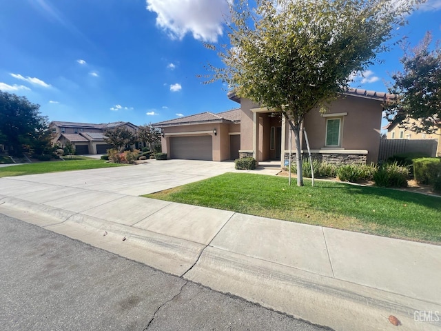 view of front of home with a garage and a front yard