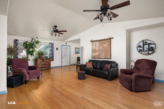 living room featuring ceiling fan, vaulted ceiling, and light wood-type flooring