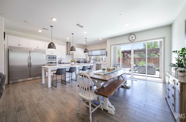 9108 Manor Forest Ln, Shafter, CA 93263 - dining space with wood finished floors and recessed lighting