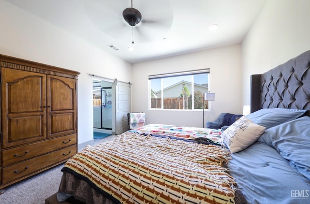 9108 Manor Forest Ln, Shafter, CA 93263 - carpeted bedroom with a barn door and ceiling fan