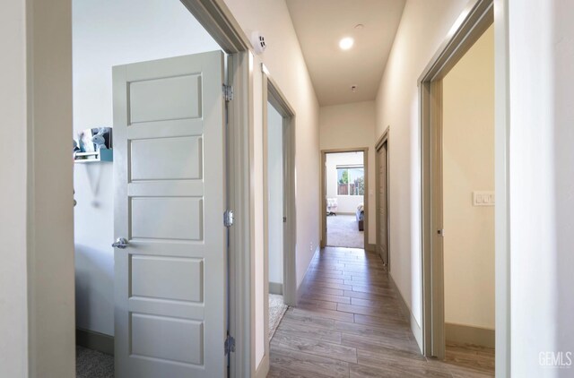 9108 Manor Forest Ln, Shafter, CA 93263 - corridor with wood finished floors and baseboards