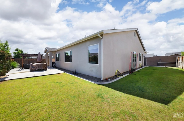 9108 Manor Forest Ln, Shafter, CA 93263 - rear view of house with a pergola, a fenced backyard, stucco siding, and a patio