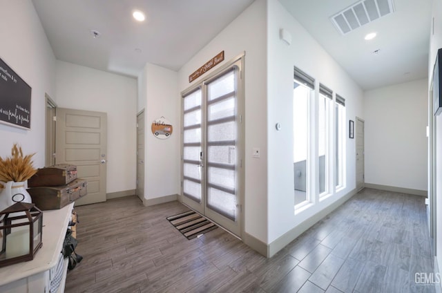 9108 Manor Forest Ln, Shafter, CA 93263 - doorway to outside featuring wood finished floors and recessed lighting