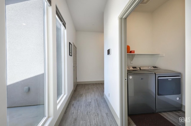 9108 Manor Forest Ln, Shafter, CA 93263 - hallway featuring washing machine and clothes dryer and wood finished floors